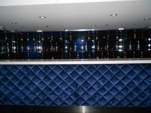 a bar with bottles on the wall
