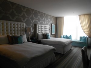 Very large and trendy room featuring two double beds
