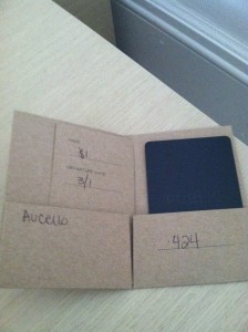 a cardboard box with a black rectangular object in it