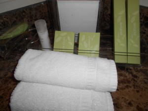 a close-up of towels and a small bottle