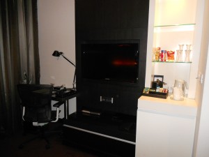Work desk, wall-mounted TV, and minibar