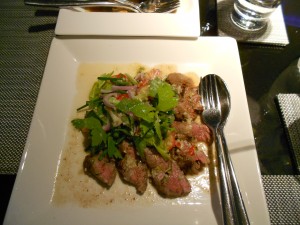 A shot of one of our dishes at Mezza: Yum Nau Yang (Grilled beef salad with Thai celery, onion, tomato and a lime dressing).